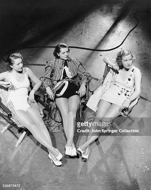 Portrait of movie extras Margaret Carthew, Betty McIvor, and Helen Ericson on the set of the 1935 film The Case of the Lucky Legs.