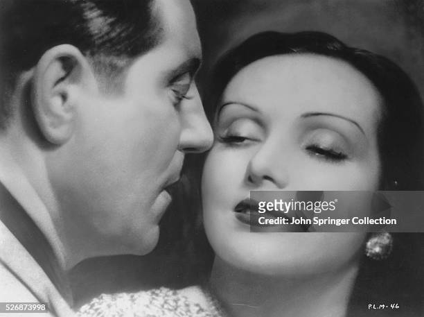 Pepe le Moko gets close to Gaby Gould in this romantic scene from the 1937 French film Pepe le Moko.