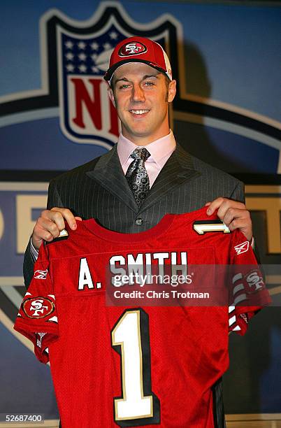 Quarterback Alex Smith poses with his jersey during the 70th NFL Draft on April 23, 2005 at the Jacob K. Javits Convention Center in New York City....