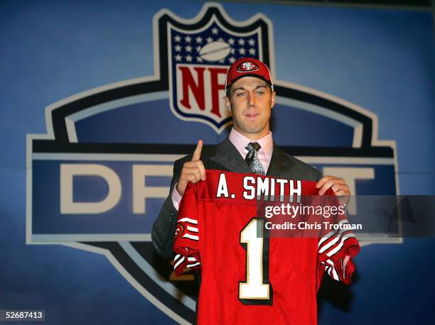 Quarterback Alex Smith poses with his jersey during the 70th NFL Draft on April 23, 2005 at the Jacob K. Javits Convention Center in New York City....