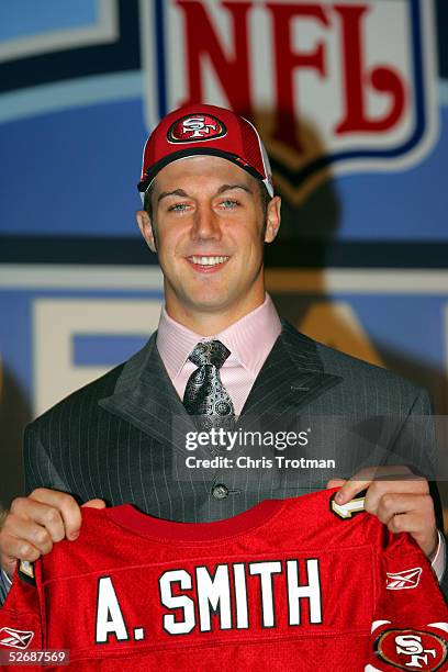 Quarterback Alex Smith poses with his jersey during the 70th NFL Draft on April 23, 2005 at the Jacob K. Javits Convention Center in New York City....