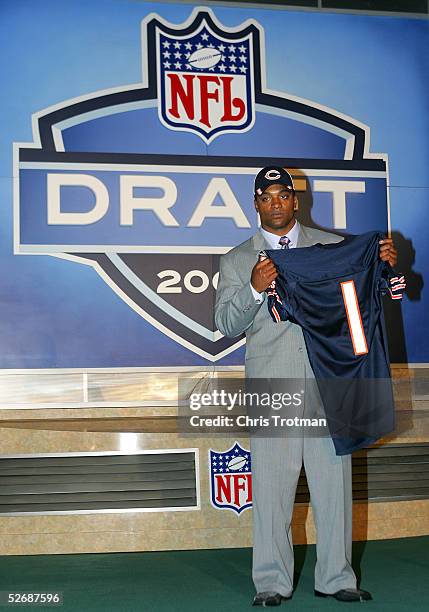 Running back Cedric Benson poses with his jersey after being drafted fourth overall by the Chicago Bears during the 70th NFL Draft on April 23, 2005...