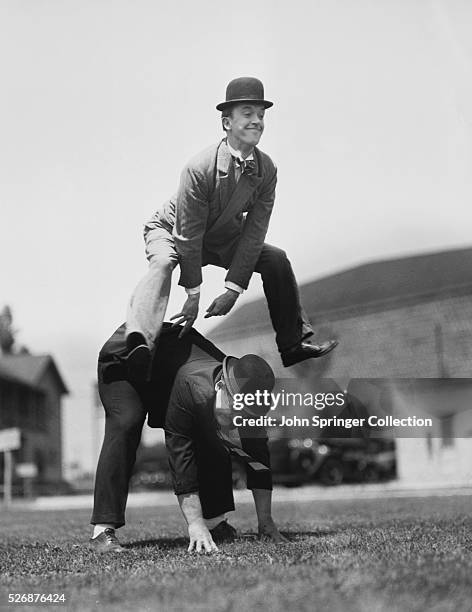 Laurel and Hardy Playing Leap Frog