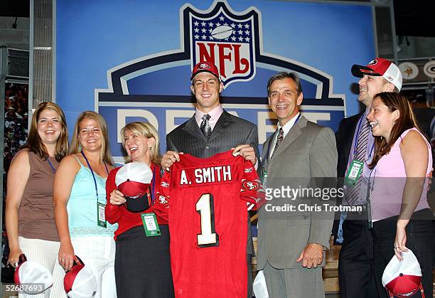 Quarterback Alex Smith , who was drafted first overall by the San Francisco 49ers, poses with his family during the 70th NFL Draft on April 23, 2005...