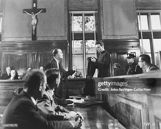 The courtroom scene from Alfred Hitchcock's 1953 film I Confess, starring Montgomery Clift as Michael Logan and Brian Aherne as Willy Robertson.