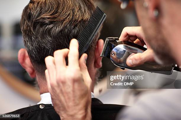 man getting his hair cut at salon - hairstyle stock pictures, royalty-free photos & images