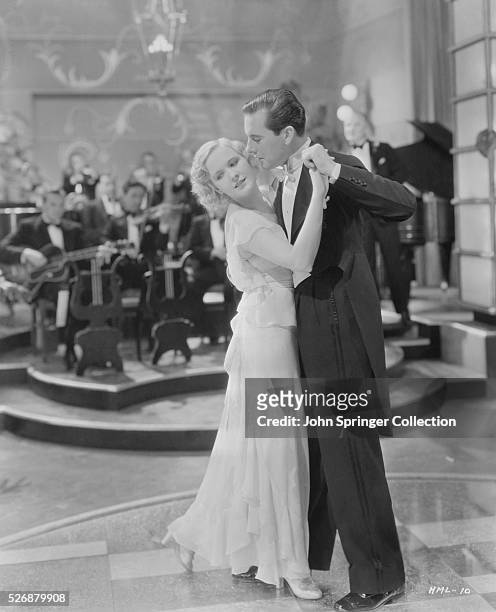 Lia Toerrek dances with Fred von Wellingen in the 1931 film musical Her Majesty, Love.