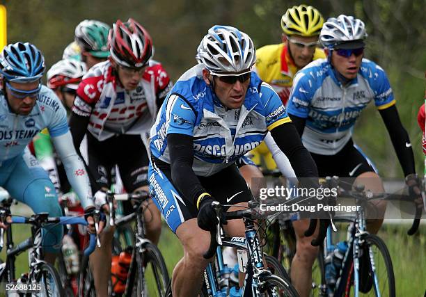 Lance Armstrong of the USA and teammate Tom Danielson of the USA and riding for the Discovery Channel Pro Cycling Team ride in the peloton during...