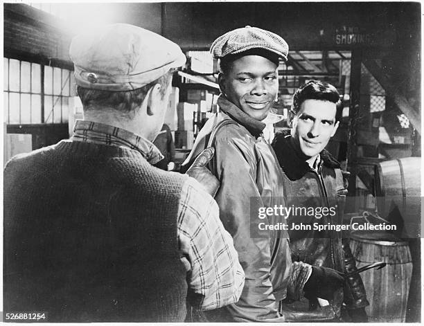 Sidney Poitier, as Tommy Tyler, and John Cassavetes, as Axel North, play dock workers in the 1957 film Edge of the City.