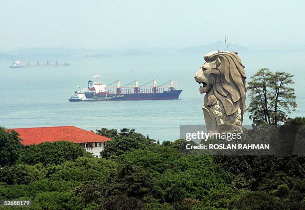 Merlion statue stands out of the greenery overlooking the waterway of Singapore straits on Sentosa Island resort, 23 April 2005. A former British...