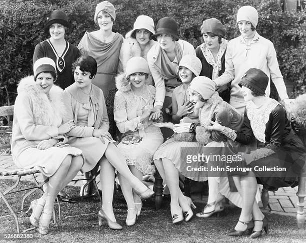 https://media.gettyimages.com/id/526882380/photo/mary-pickford-is-surrounded-by-fellow-warner-brothers-actresses-during-her-tea-party-left-to.jpg?s=612x612&w=gi&k=20&c=1tm04ABVCyIT6zd6BjCKfZE70U52VxhMZyt7A7NqByo=