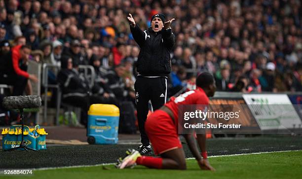 Swansea City coach Francesco Guidolin reacts during the Barclays Premier League match between Swansea City and Liverpool at The Liberty Stadium on...