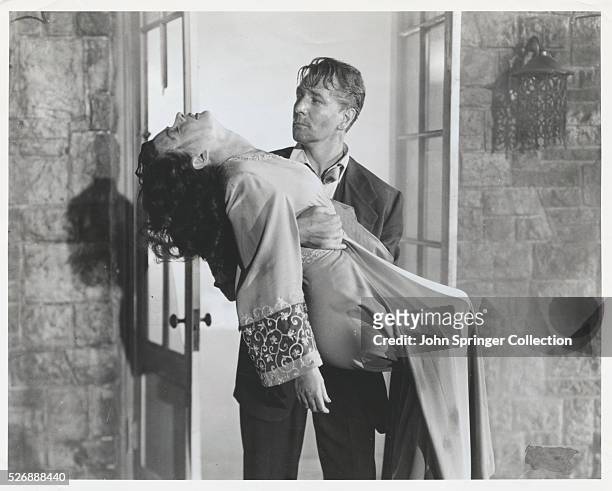 Actor Michael Redgrave as Mark Lamphere and actress Joan Bennett as Celia Lamphere in the 1948 film Secret Beyond the Door.