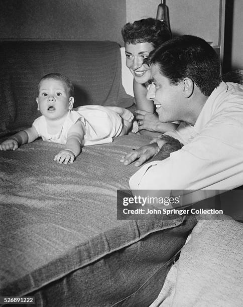 Comedian Jerry Lewis and his wife Patti can't take their eyes off their infant son.
