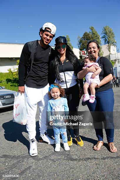 Henderson Alvarez of the Oakland Athletics enjoys time with his family following the game against the Kansas City Royals at the Oakland Coliseum on...