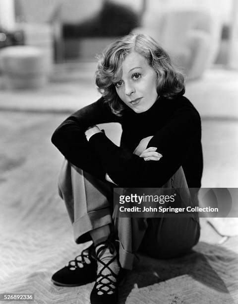 Actress Margaret Sullavan Seated on Floor