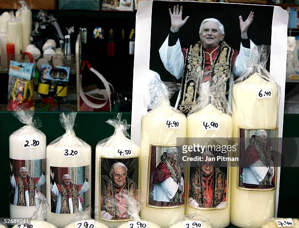 Candles with a picture of the new pope, Cardinal Joseph Ratzinger, pope Benedikt XVI, are offered on April 24, 2005 in a store in Altoetting,...
