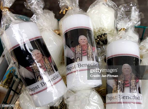 Candles with a picture of the new pope, Cardinal Joseph Ratzinger, pope Benedikt XVI, are offered on April 24, 2005 in a store in Altoetting,...