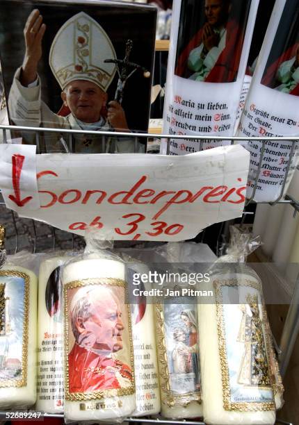 Candles with a picture of former pope John Paul II are offered on sale for a special price in a store in Altoetting, Germany, close to Marktl, the...