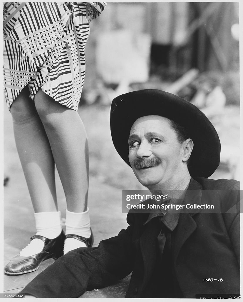 Actor Ben Turpin near Woman's Legs