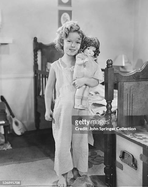 Shirley Temple appears as orphaned Shirley Blake in Bright Eyes.