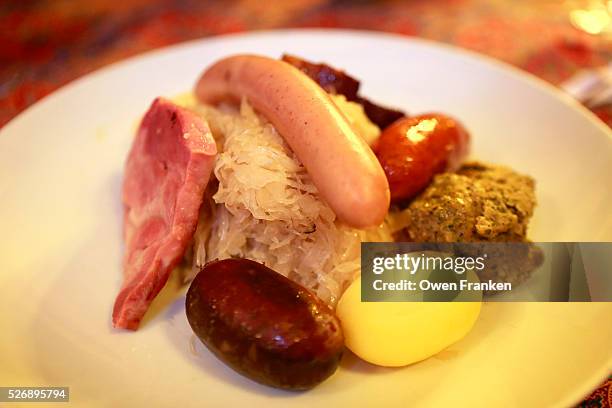 classic choucroute garnie- sauerkraut in an alsatian bistro in strasbourg - sauerkraut stock pictures, royalty-free photos & images