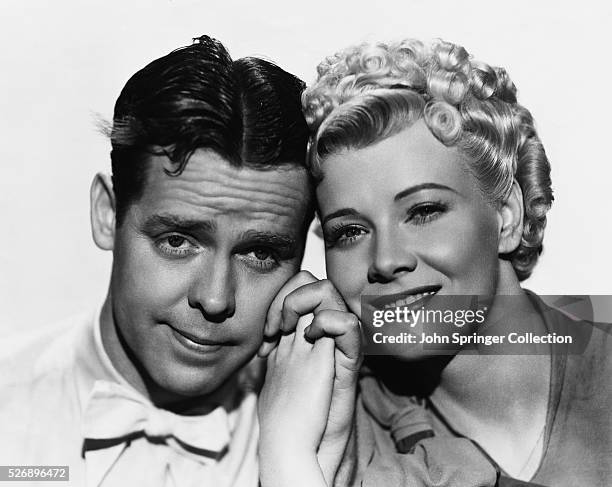 Arthur Lake plays Dagwood Bumstead and Penny Singleton plays his wife Blondie Bumstead in the Blondie film series of the 1930s and 1940s.