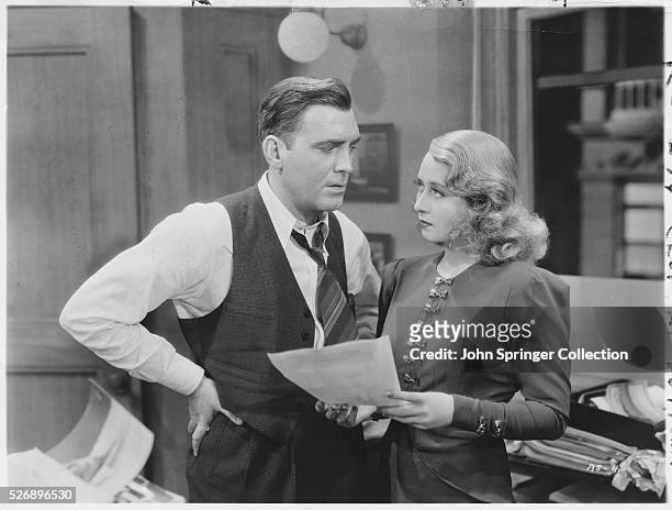 Pat O'Brien, as editor Bill Morgan, and Joan Blondell as his paper's top journalist, Timmy Blake, in the 1937 film Back in Circulation.