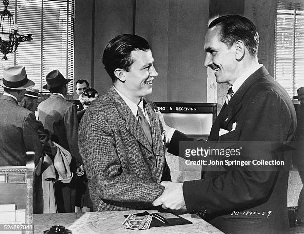 Harold Russell as the injured veteran Homer Parrish, and Frederic March as Al Stephenson, in the 1946 film The Best Years of Our Lives.