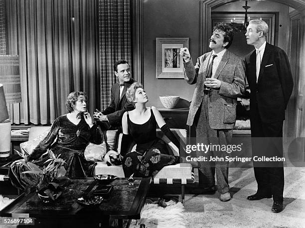 Elsa Lanchester as Queenie, Jack Lemmon as Nicky Holroyd, Kim Novak as Gillian Holroyd, Ernie Kovacs as Sidney Redlitch, and James Stewart as...