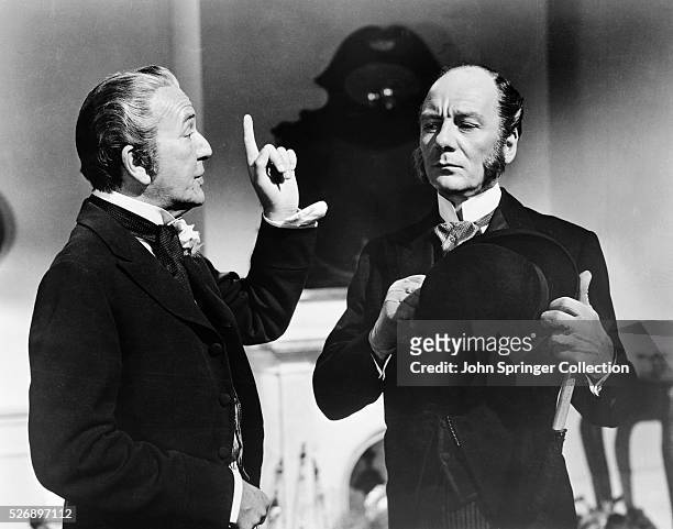 Noel Coward as Hesketh-Baggott and John Gielgud as Mr. Foster in the 1956 production of Around the World in 80 Days.