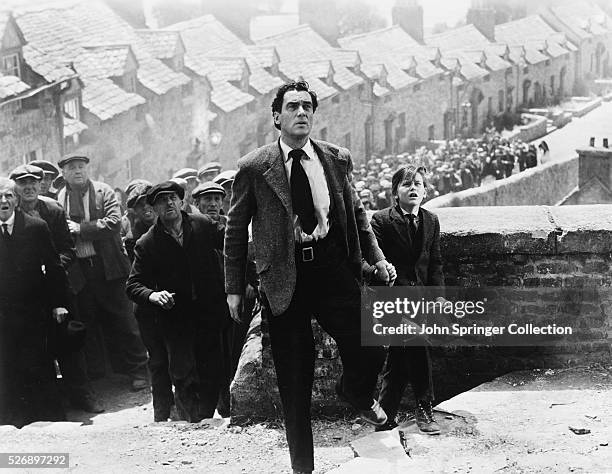 Walter Pidgeon as Mr. Gruffydd and Roddy McDowall as Huw Morgan in the 1941 film How Green Was My Valley.