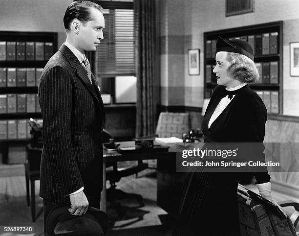 Franchot Tone as Donald Bellows and Bette Davis as Joyce Heath in the 1935 film Dangerous.