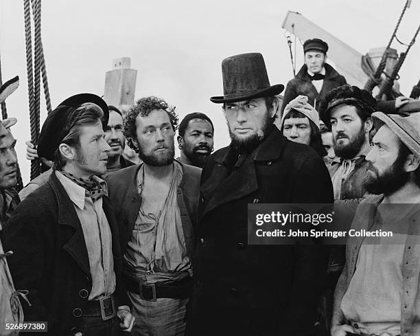 Gregory Peck as Captain Ahab surrounded by his doomed crew in Moby Dick.