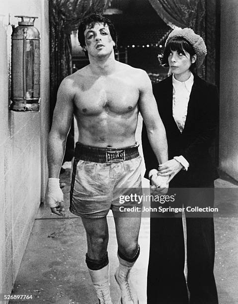 Sylvester Stallone as Rocky Balboa and Talia Shire as Adrian in Rocky.