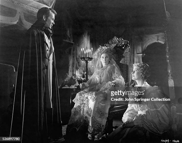 JOHN MILLS AS PIP, MARTITA HUNT AS MRS. HAVERSHAM, AND VALERIE HOBSON AS STELLA IN A SCENE FROM THE DAVID LEAN DIRECTED ADAPTATION OF CHARLES...