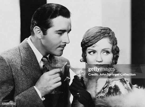 John Boles as Paul Vanderkill and Nancy Carroll as Madeleine McGonegal in Child of Manhattan .