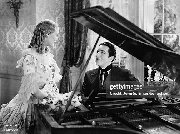 John Boles as Carl Hausmann, and Gloria Stuart as Lucy Hausmann in the 1934 film Beloved.