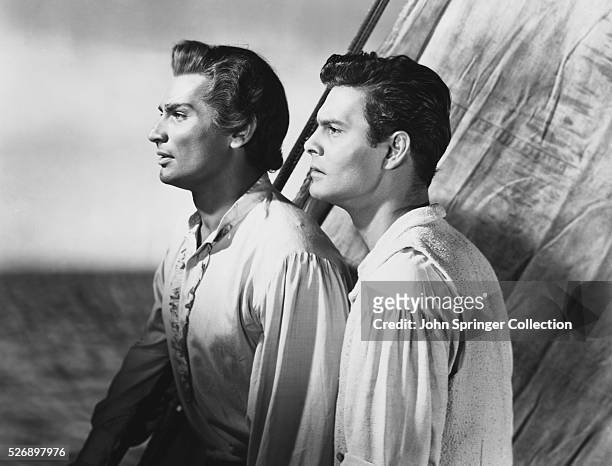 Jeff Chandler as Tenga, and Louis Jourdan as Andre Laurence in the 1951 film Bird of Paradise.