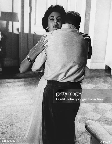 Maggie Pollitt hugging Brick Pollitt in the 1958 film Cat on a Hot Tin Roof.