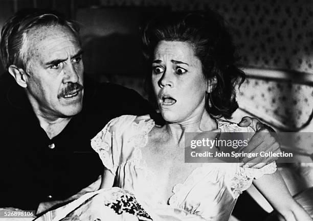 Dashiell Hammett comforts Lillian Hellman when she wakes from a nightmare in the 1977 film Julia.