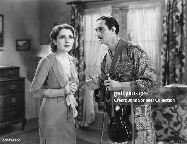 Billie Dove as Patricia Hanley Gherardi, and Basil Rathbone as Paul Gherardi in the 1930 film A Notorious Affair.