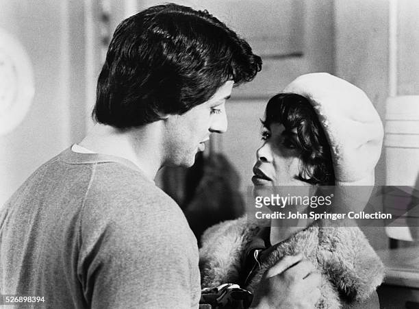Sylvester Stallone as Rocky Balboa and Talia Shire as Adrian in Rocky.