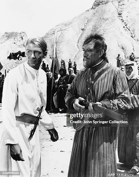 Peter O'Toole as T.E. Lawrence and Anthony Quinn as Auda abu Tayi in Lawrence of Arabia.