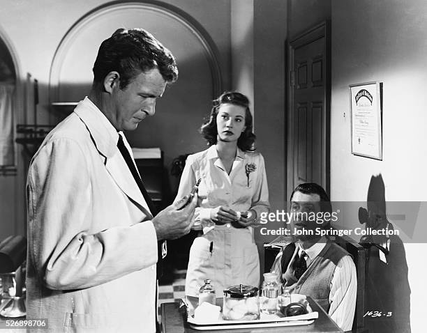 Dr. Sanderson and nurse Kelly examine Elwood P. Dowd in the 1950 film Harvey.
