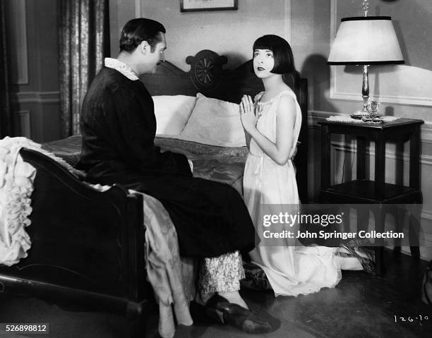 Edmund Lowe as Babe Stewart and Colleen Moore as Mary Randall in the 1928 silent film Happiness Ahead.