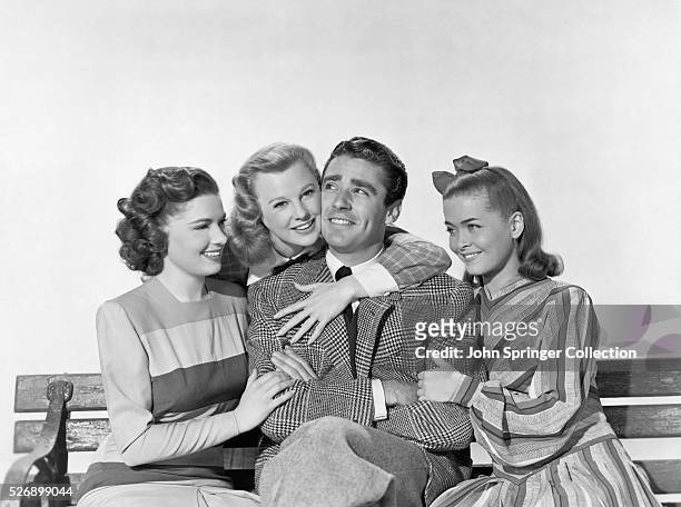 Tommy Marlowe is surrounded by women as he sits on a bench in the 1947 film Good News.The Women are from left: Babe Doolittle , Connie Lane , and Pat...
