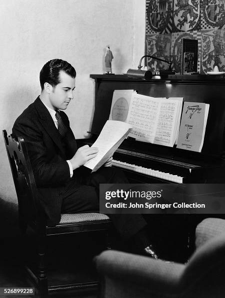 Actor Ramon Novarro Reading at Piano Actor Ramon Novarro Reading at Piano