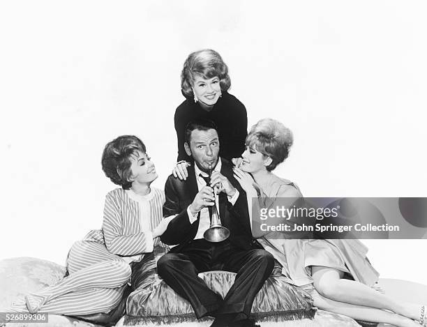 Frank Sinatra Playing a Horn for Three Women