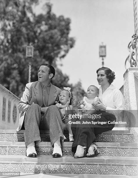 George Burns and Gracie Allen with their two adopted children Sandra age 2, and Ronnie age 9 months.